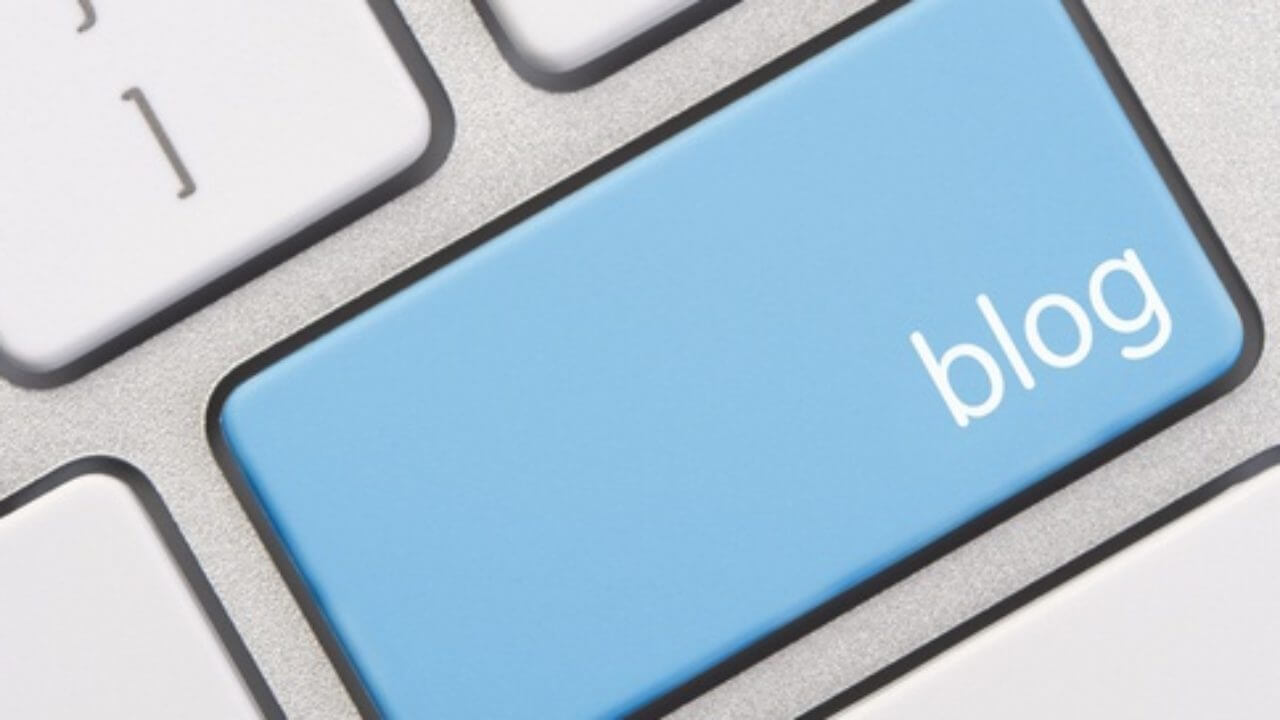 a close up of a keyboard with a blue button.