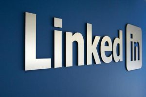 a linked logo on a blue wall.