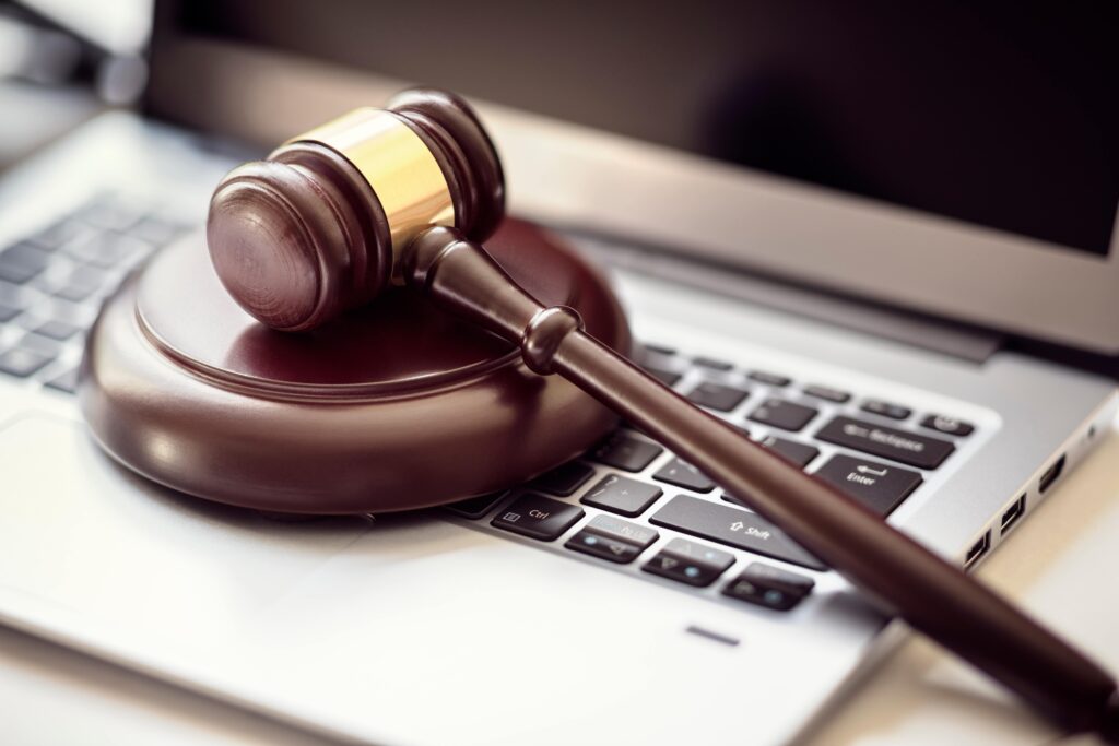 A gavel rests on a computer keyboard.