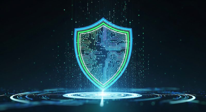 A glowing shield with circuit board patterns stands at the center of a digital, futuristic background, symbolizing cybersecurity, data protection, and what an online reputation means in the digital age.