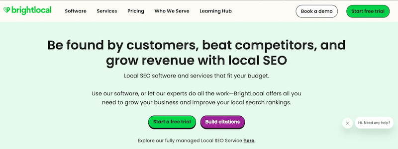 Screenshot of BrightLocal’s website homepage with a green header, promotional text about local SEO and the best reputation management software, plus buttons for starting a free trial, building citations, and booking a demo. Chat support icon appears at bottom right.