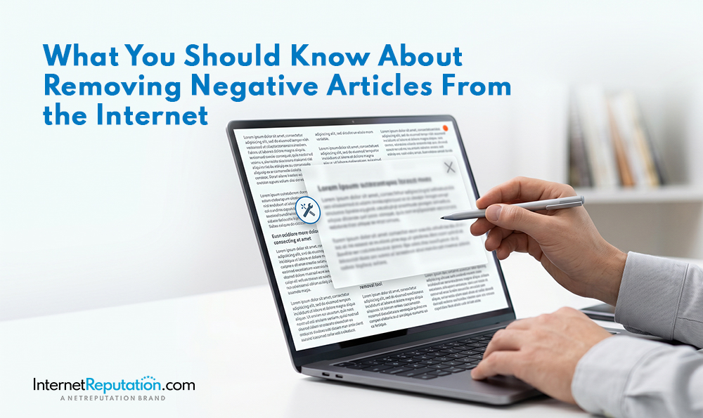 A person holds a pen and points at a laptop screen displaying an article with a pop-up about removing negative articles from the internet. Text on the image reads, "What You Should Know About Removing Negative Articles From the Internet.